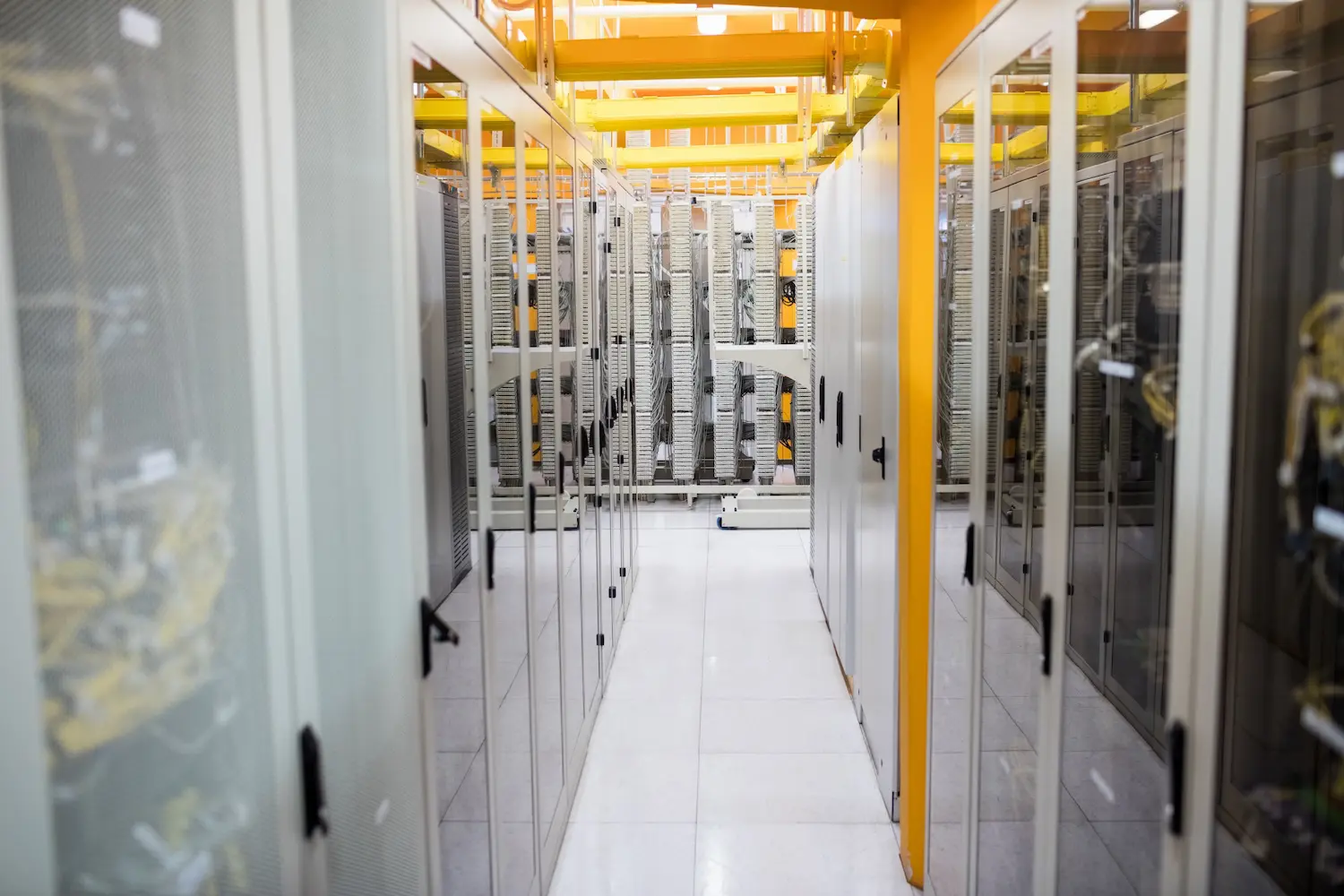 Hallway with a row of servers in a data center